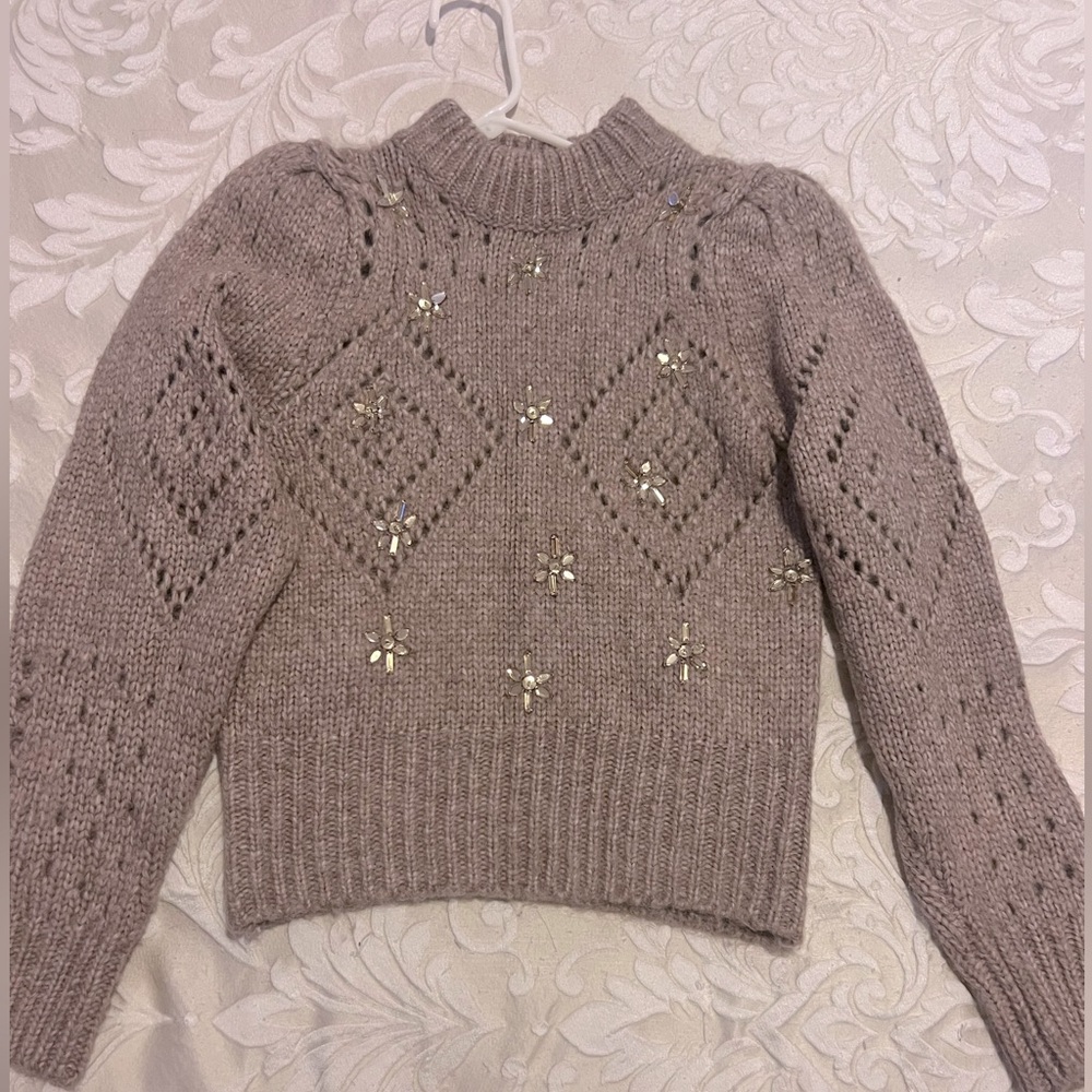 Beautiful sweater with embellishment. Perfect for holidays.